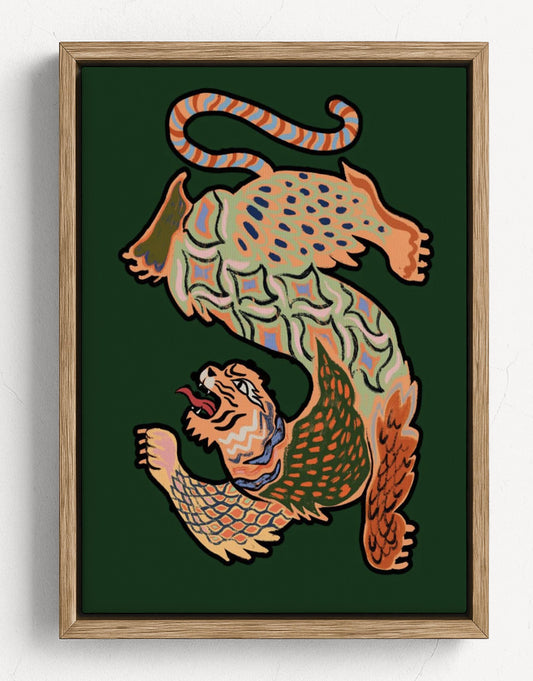 Framed wall art featuring a stylized, patterned animal illustration in warm tones on a dark green background, shown in a light wood frame against a white wall. Asian Tiger Green – Framed Poster Detail