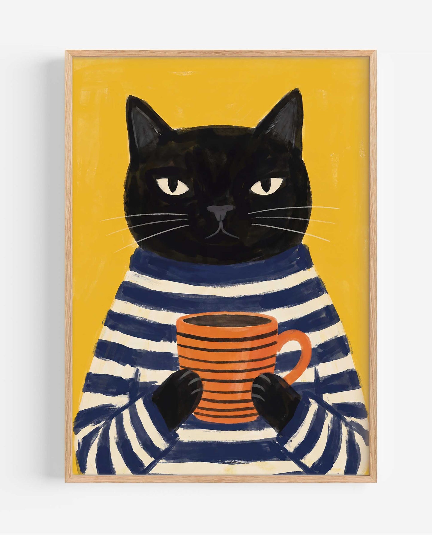 A framed art print featuring a black cat wearing a navy and cream striped sweater and holding an orange mug against a mustard yellow background.