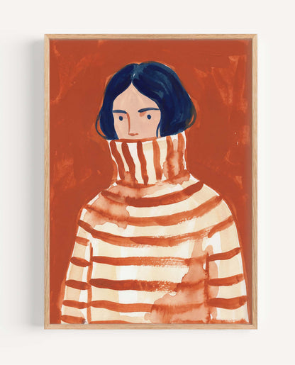 A framed watercolor portrait print of a person with dark hair wearing a striped turtleneck sweater, set against a warm rust-orange background.