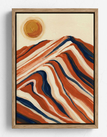 Framed abstract landscape painting featuring wavy mountain-like forms in terracotta, cream, and navy, with a circular sun in the upper left, shown against a light wall.
