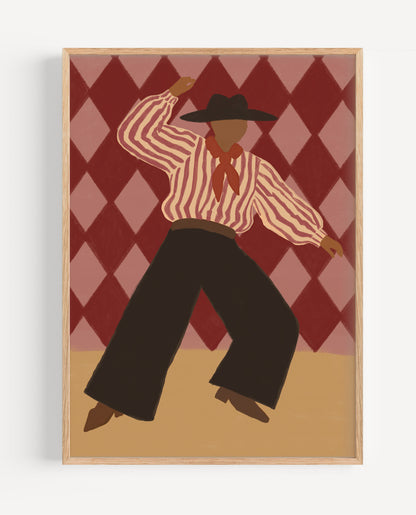 A framed art print featuring a stylized illustration of a cowboy dancing in front of a red and pink argyle background, mounted on a light gray wall.