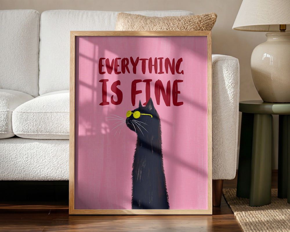Framed artwork with a black cat and 'Everything is Fine' text on a pink background, placed in a living room.