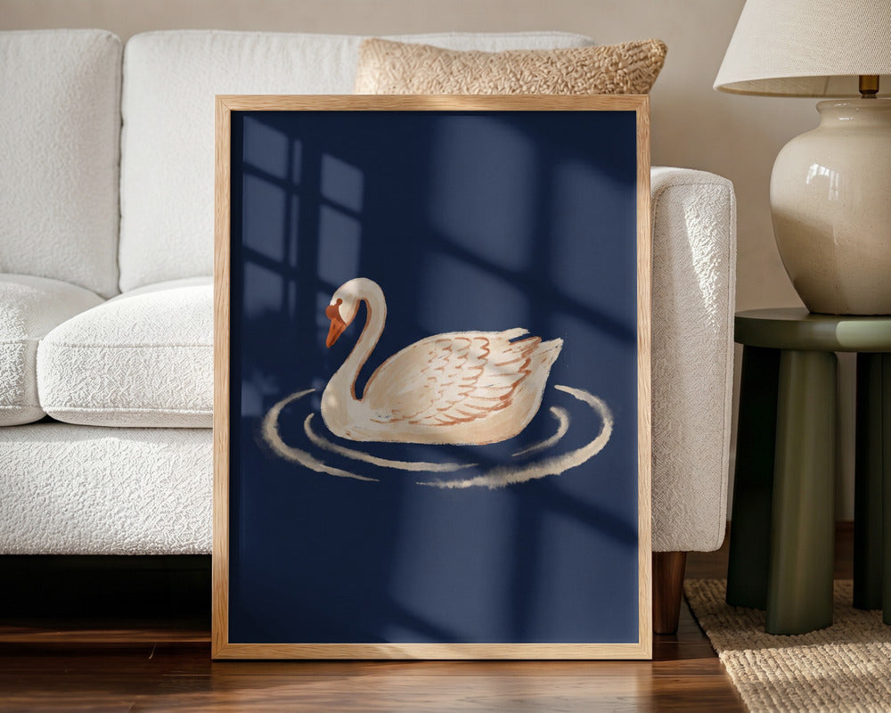 Framed artwork of a swan on water in a living room setting