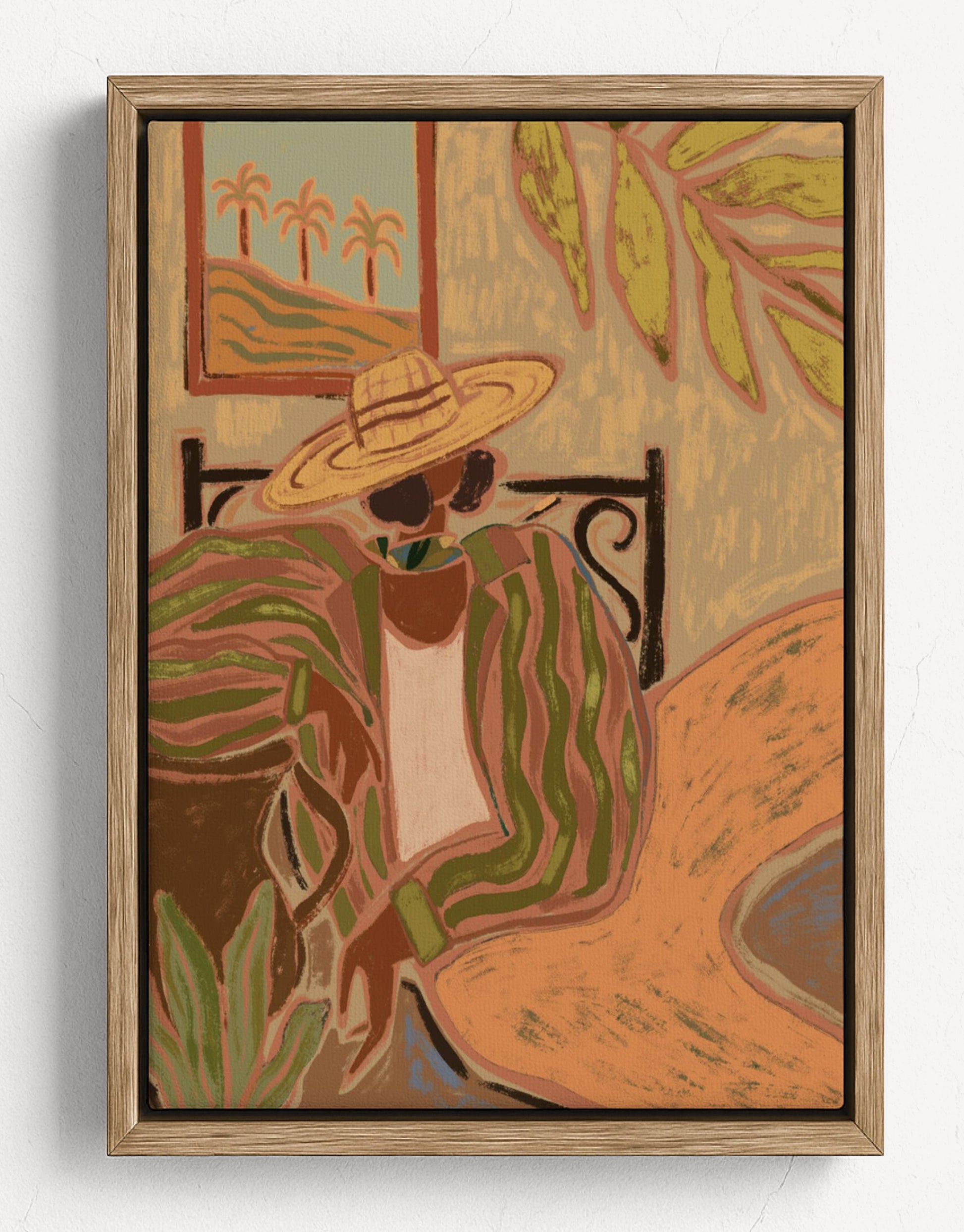 Framed artwork of a person wearing a wide-brimmed hat with a tropical setting.