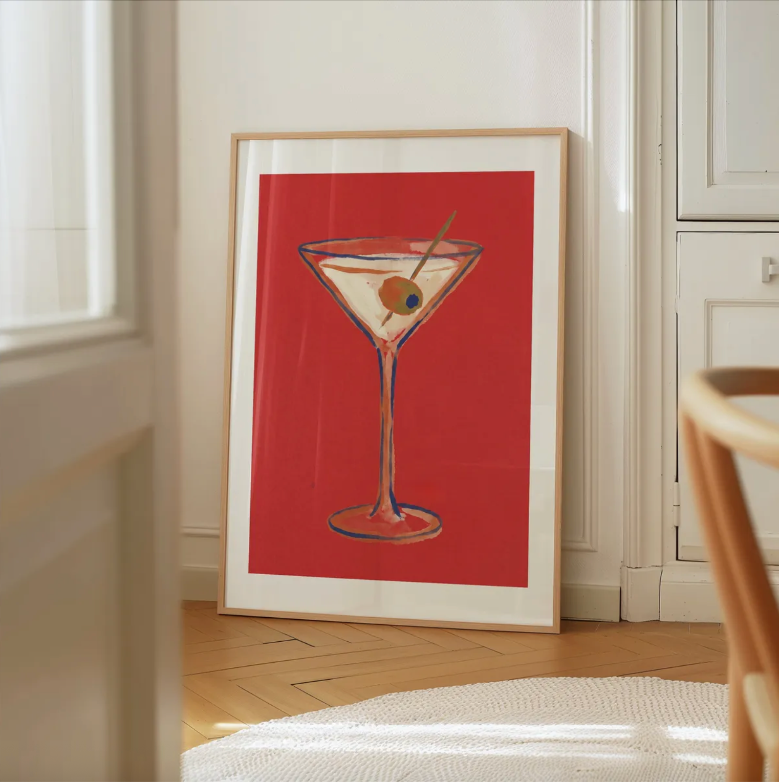 Classic martini wall art with bold red background and blue accents
