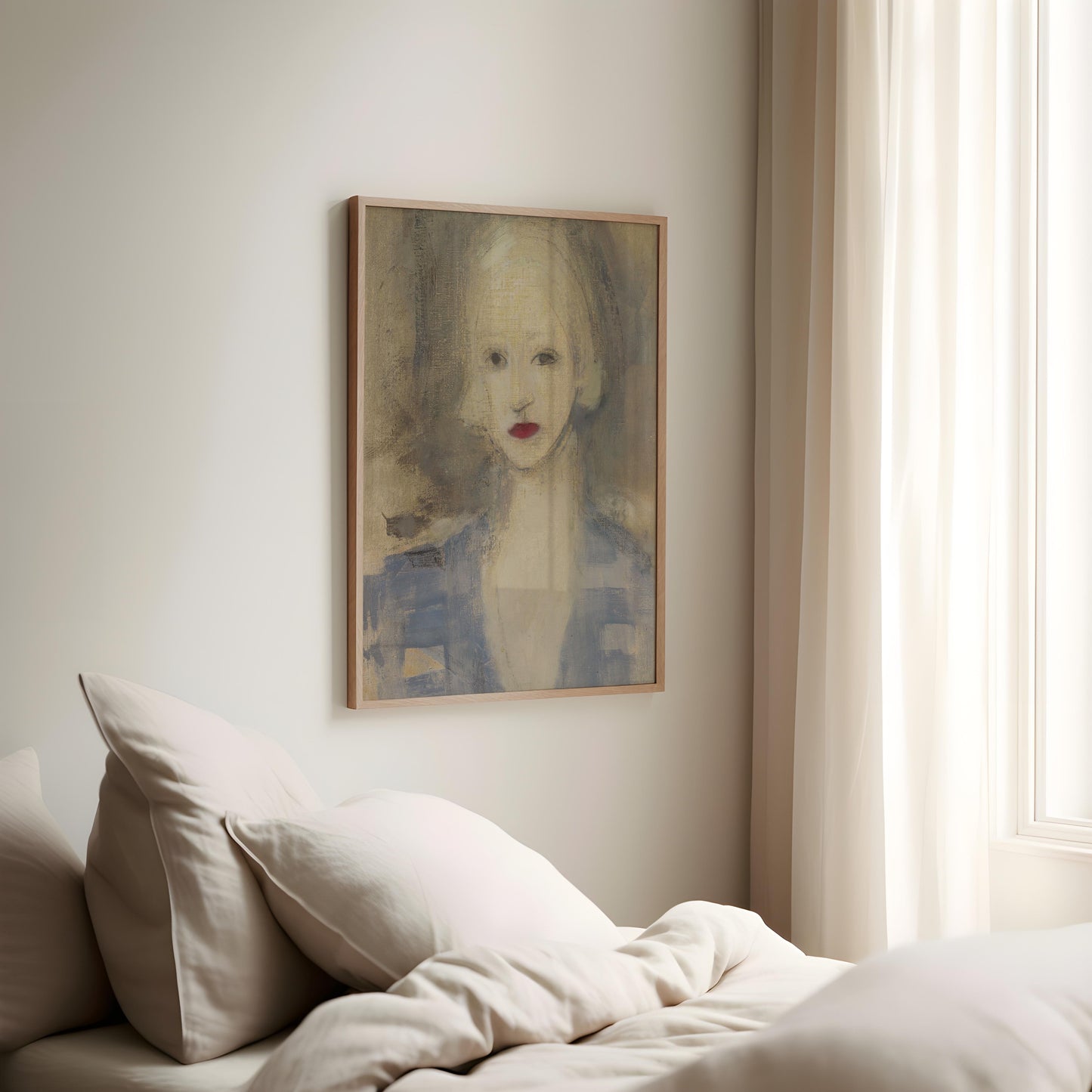 A framed portrait painting of a woman with red lips hangs on a light beige wall above a bed with cream bedding and pillows, next to a window with sheer curtains.