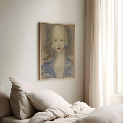 A framed portrait painting of a woman with red lips hangs on a light beige wall above a bed with cream bedding and pillows, next to a window with sheer curtains.