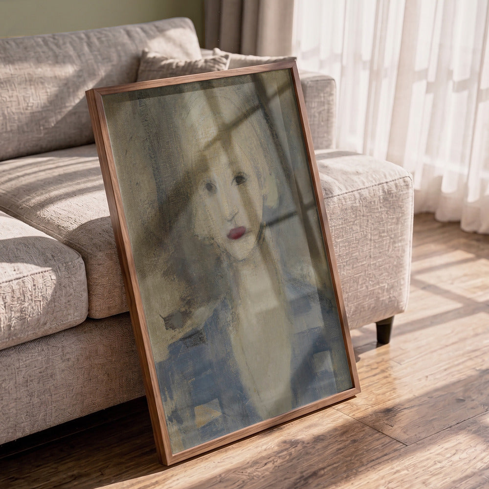 A framed portrait painting of a woman with soft, impressionistic brushstrokes, leaning against a light beige sofa on a wooden floor in a sunlit room.