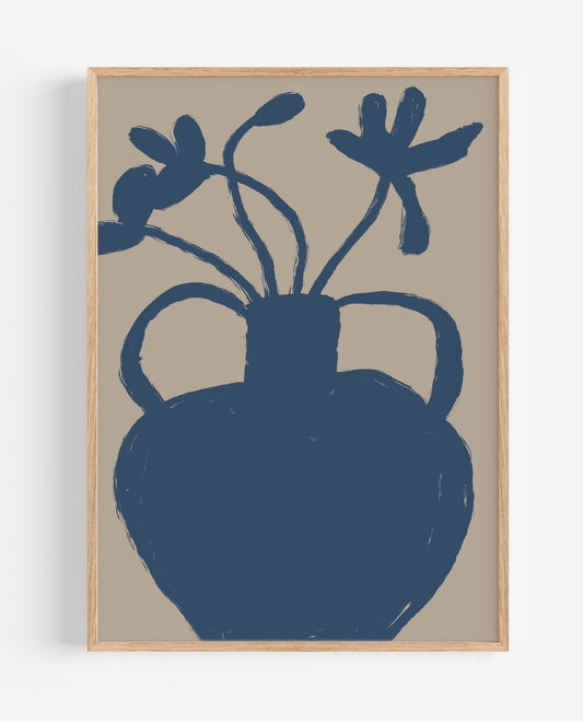 A framed art print featuring a dark blue silhouette of an ancient-style vase with flowers, set against a warm beige background, enclosed in a light natural wood frame.