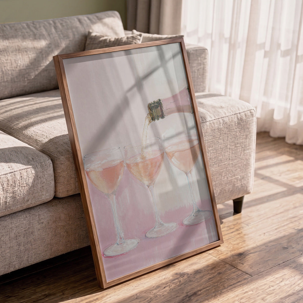Framed artwork of wine glasses on a wooden floor with a couch in the background