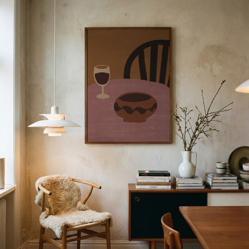Dining room with a chair, table, and wall art depicting a chair, wine glass, and bowl.