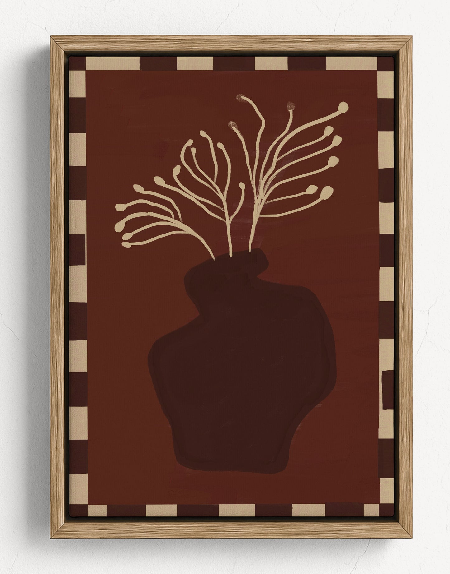Decorative wall art with a vase and branches on a brown background, framed in wood.